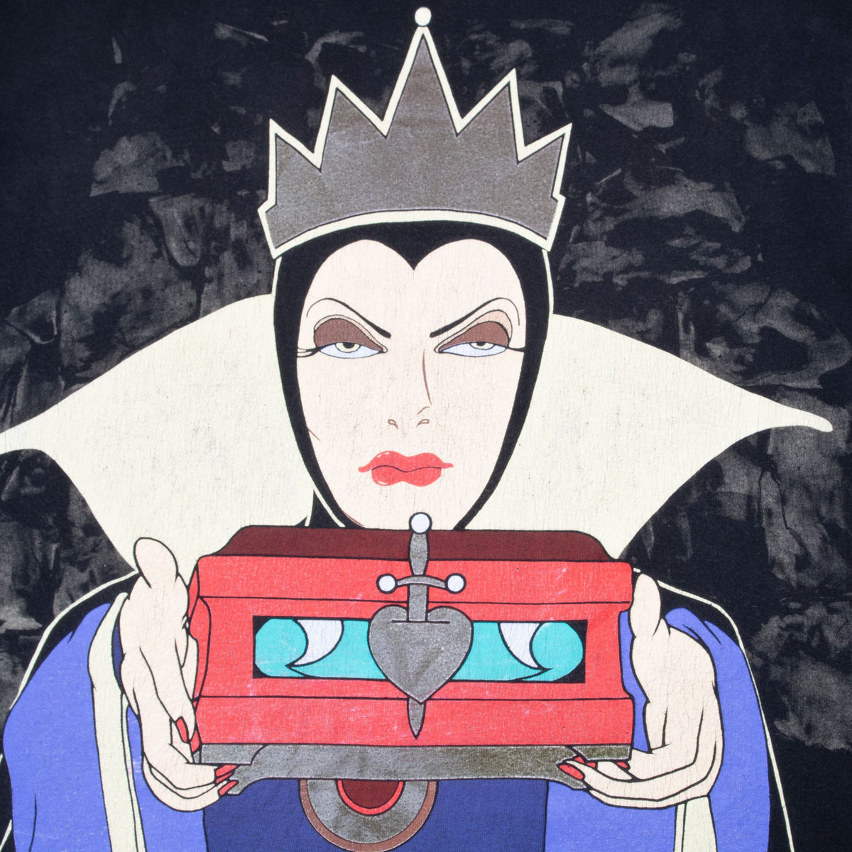 Close-up of Evil Queen graphic holding a red heart box on black T-shirt