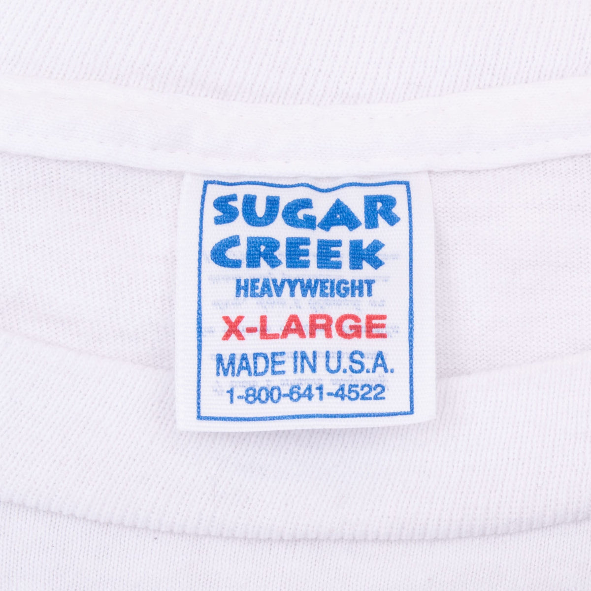 Sugar Creek Heavyweight X-Large Made in USA neck tag on white T-shirt