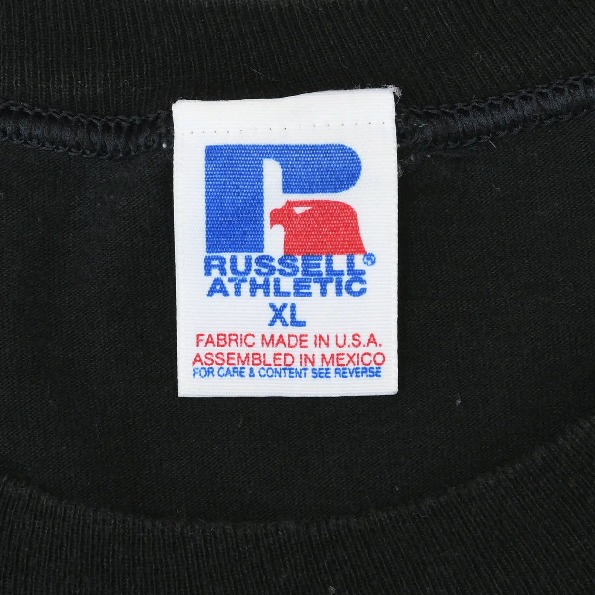Russell Athletic XL neck tag stating fabric made in USA and assembled in Mexico