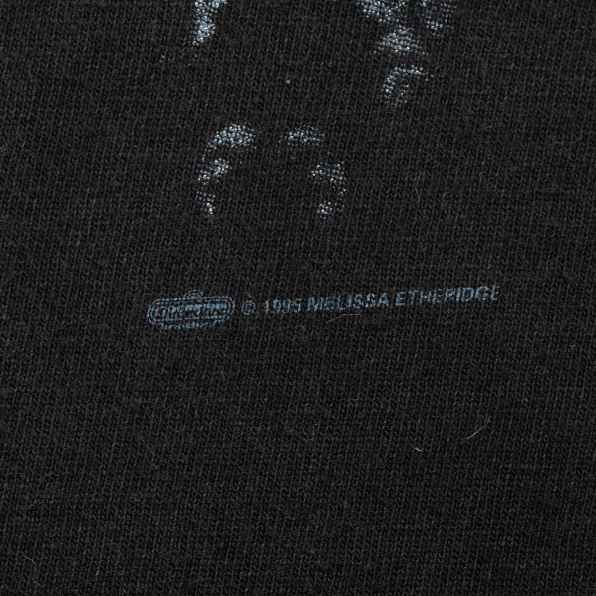 Close-up of copyright text beneath the Melissa Etheridge front graphic