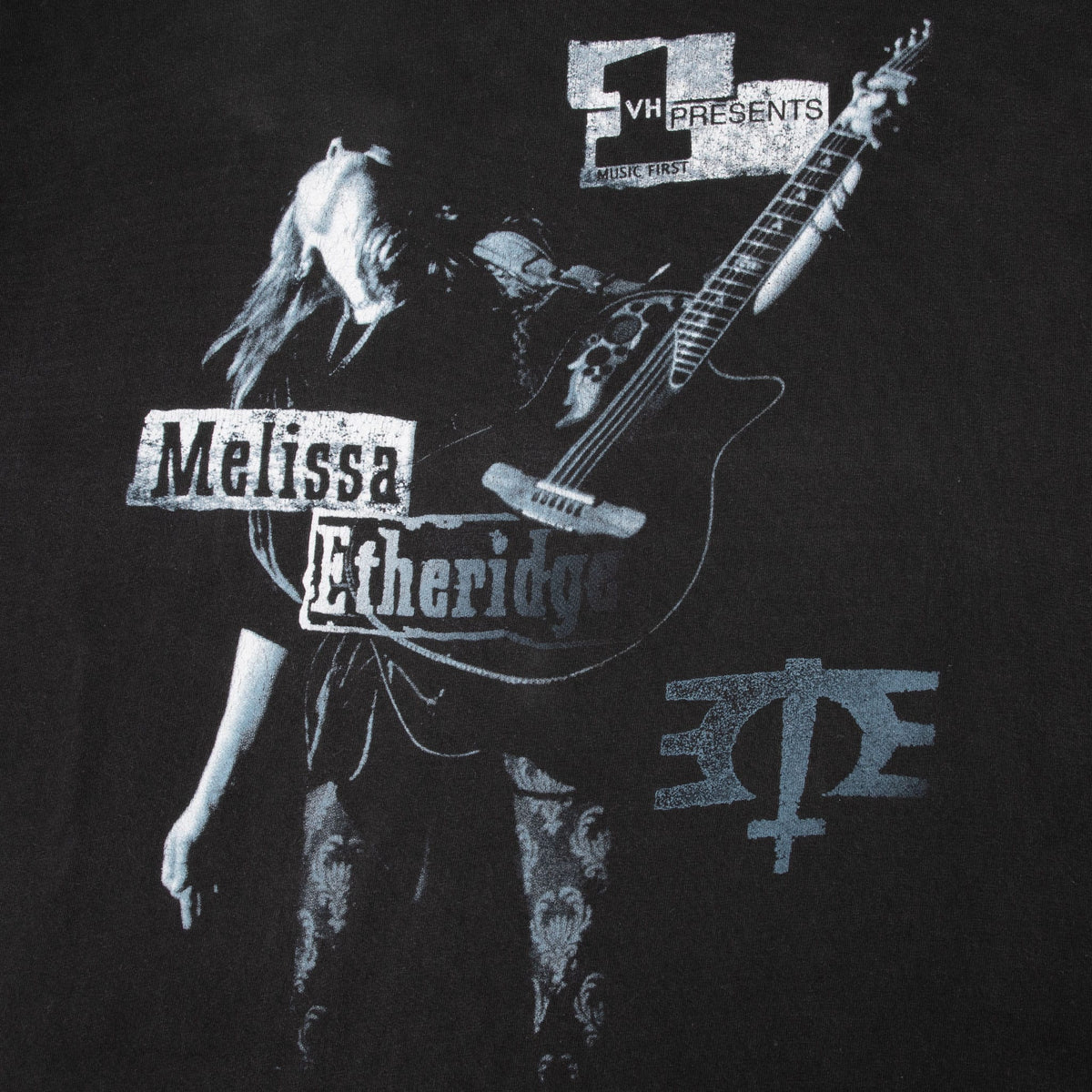Close-up of Melissa Etheridge guitar performance front print with VH1 branding