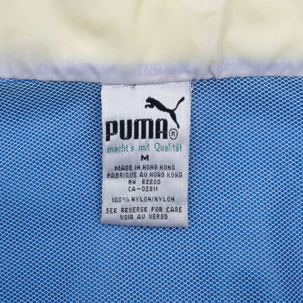 Puma medium garment label inside blue mesh lining