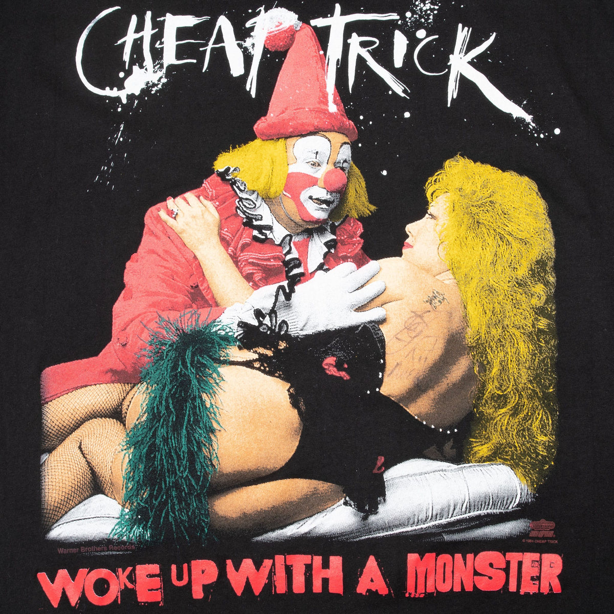 Close-up of Cheap Trick Woke Up with a Monster front graphic in white, red, yellow and green