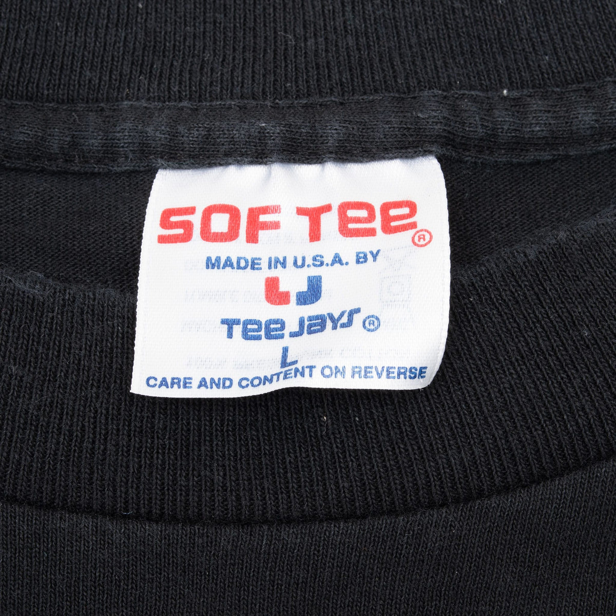Sof Tee by Teejays neck label on black Clint Black T-shirt