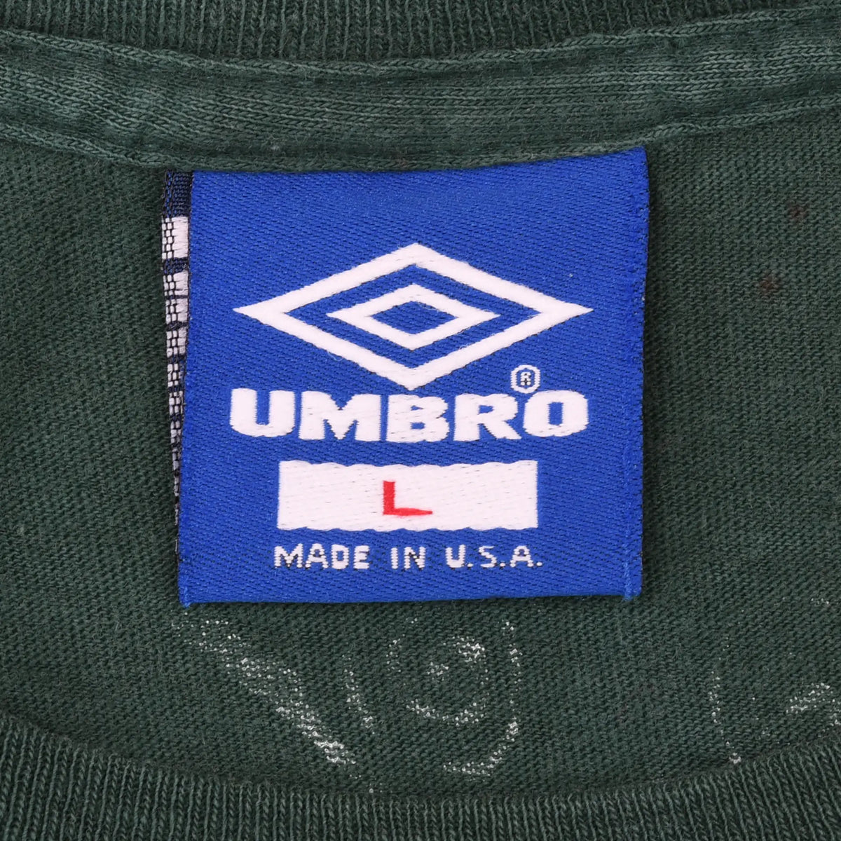 Blue Umbro large Made in U.S.A. neck label on green T-shirt