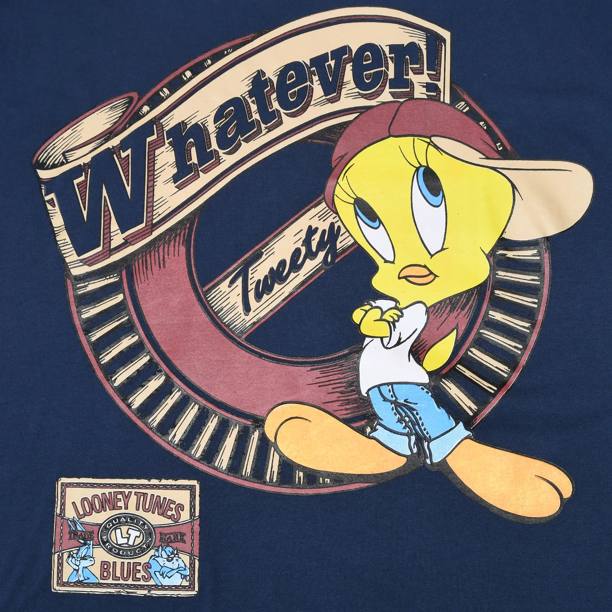Close-up of Tweety wearing a cap with Whatever lettering and Looney Tunes Blues graphic