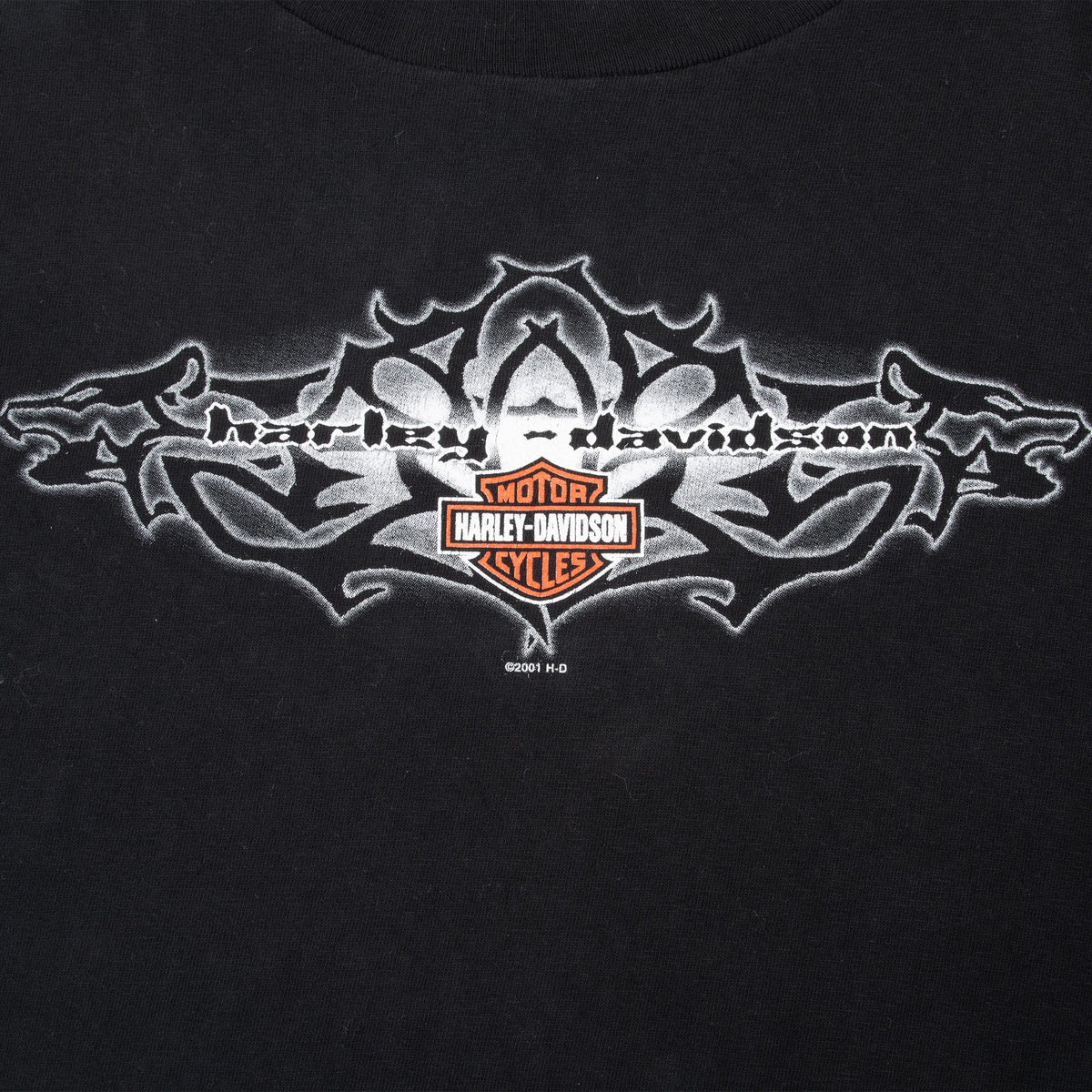 Close-up of gray, white, and orange Harley-Davidson front chest graphic