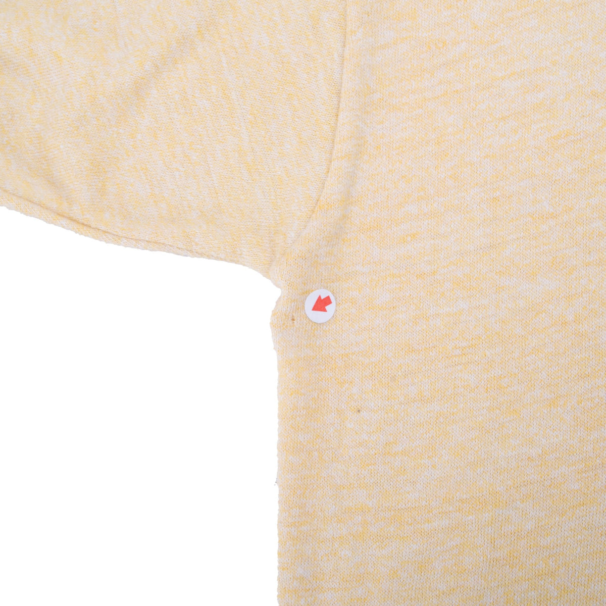 Close-up of underarm seam with marker indicating an area of wear
