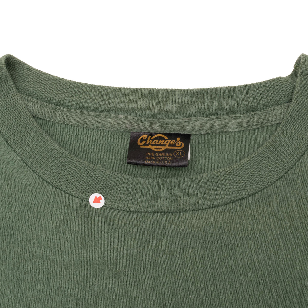 Close-up of green crewneck collar and Changes XL label