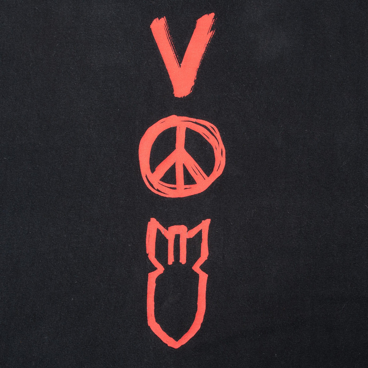 Close-up of red V, peace symbol and bomb print on front of black U2 T-shirt