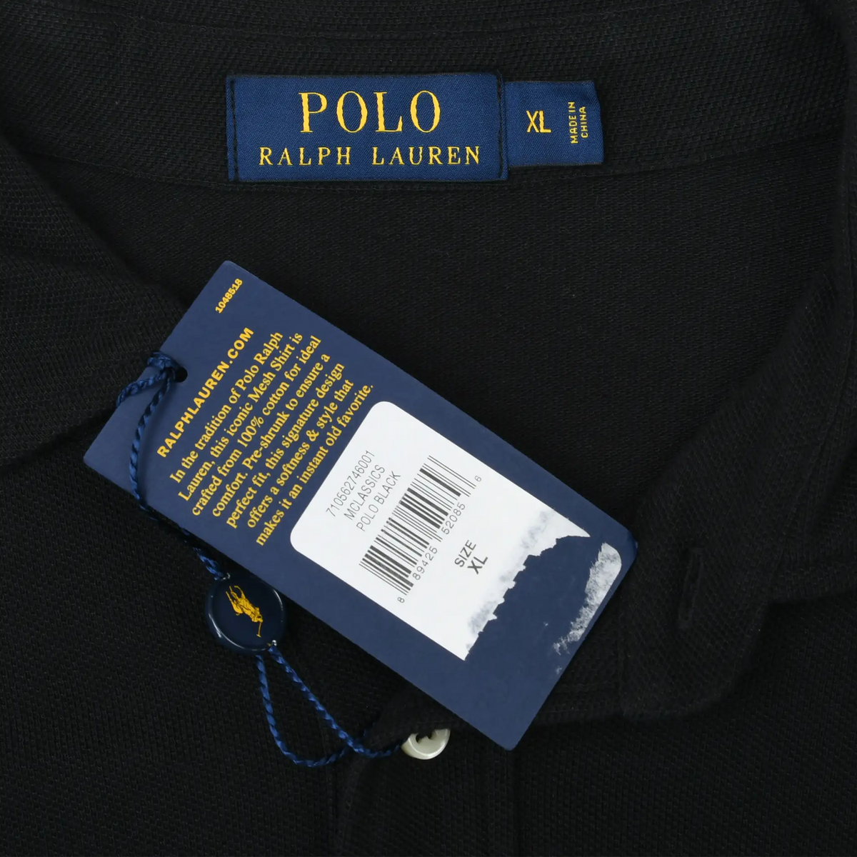 Close-up of Polo Ralph Lauren XL neck label and attached product hangtag on black polo shirt