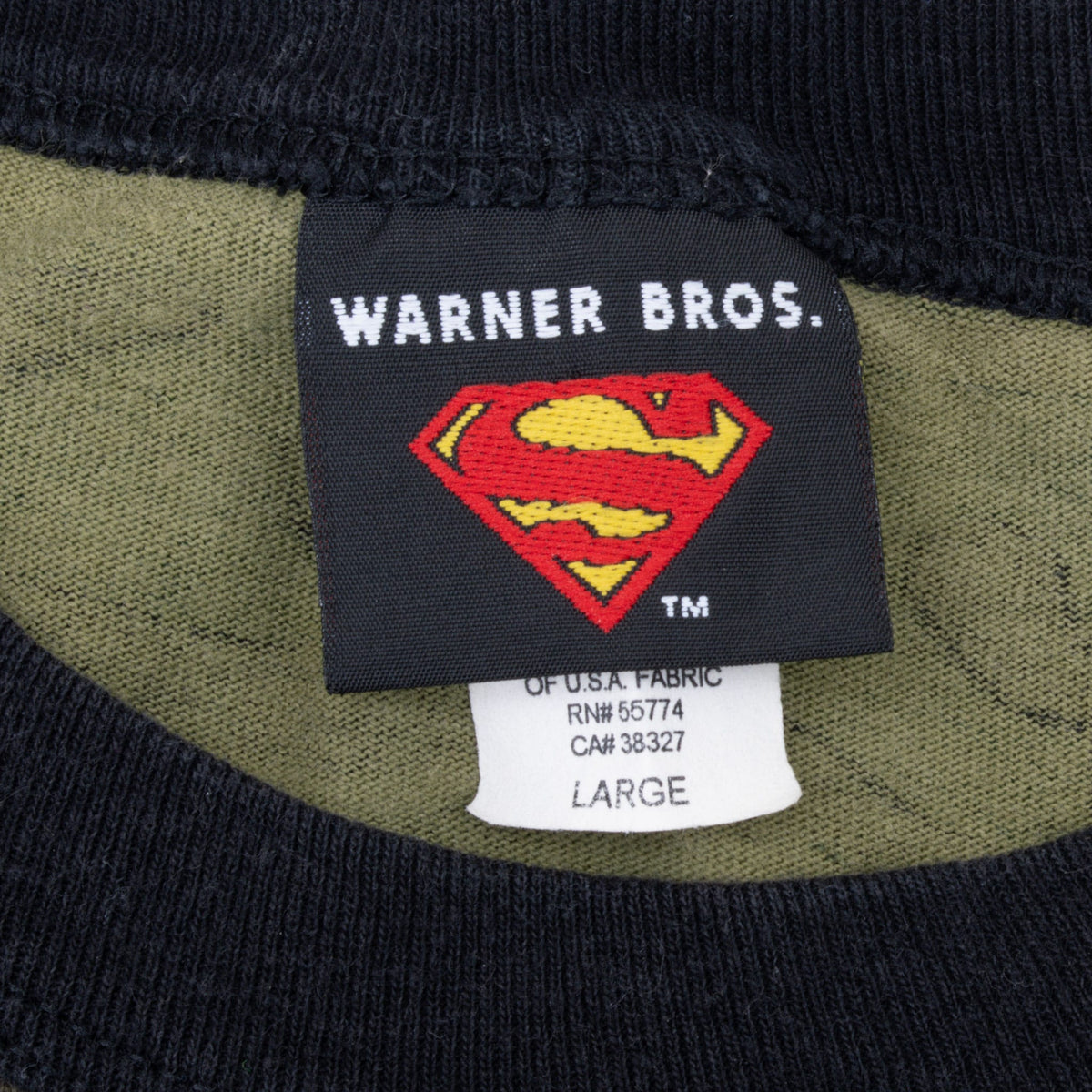 Warner Bros. Superman neck label and size Large tag beneath black ribbed collar