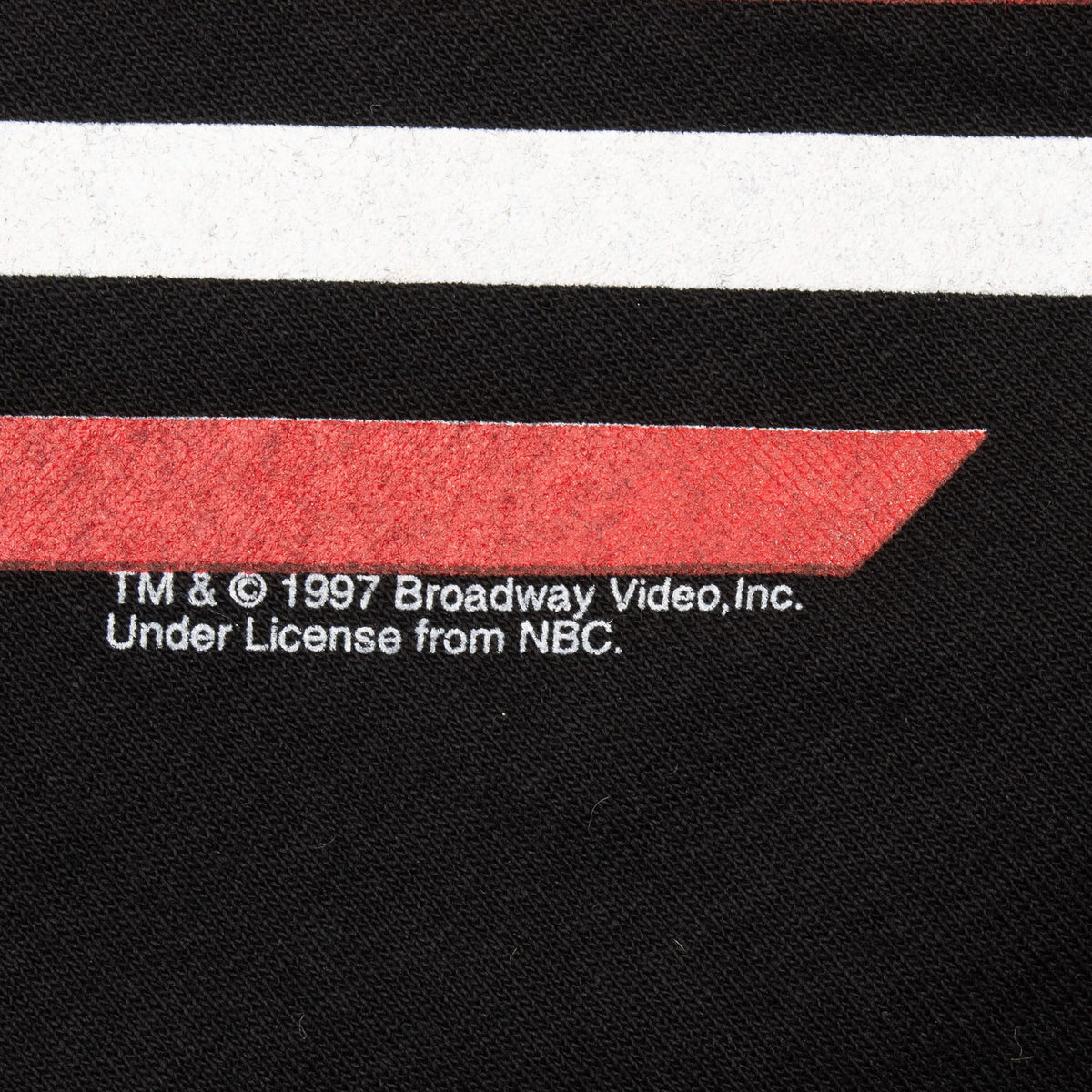 Close-up of 1997 Broadway Video and NBC licensing text beneath the front graphic