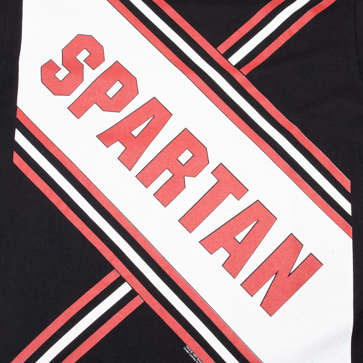 Close-up of red and white Spartan lettering and diagonal stripe print