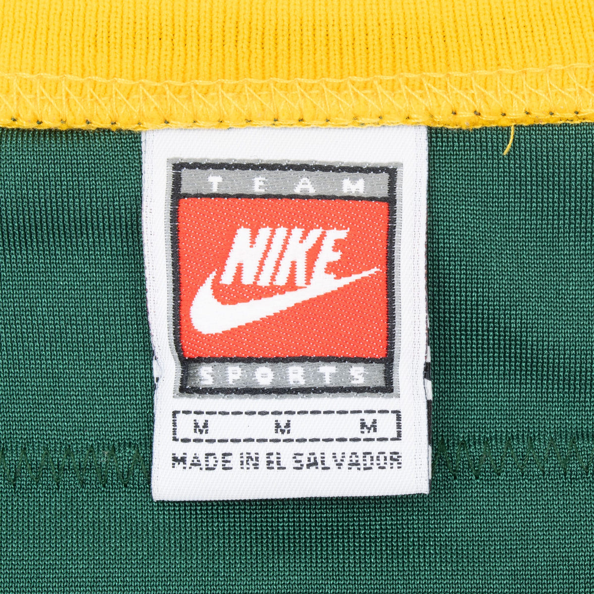 Nike Team Sports neck label on green jersey marked size medium