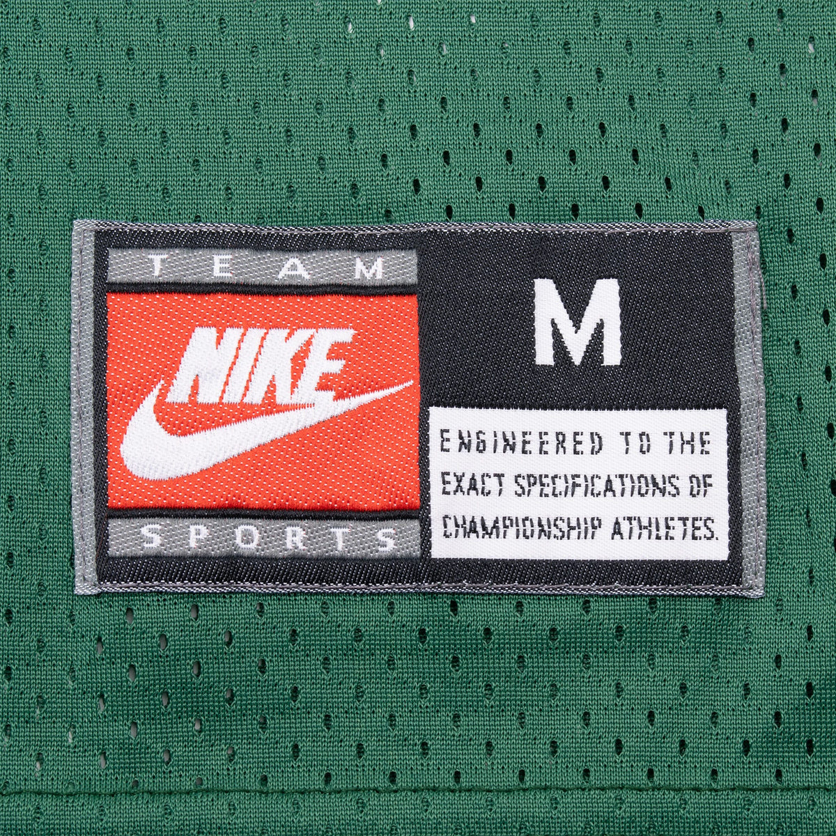 Nike Team Sports size medium jock tag on green mesh jersey