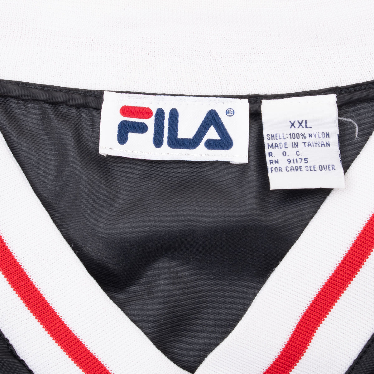 Fila neck label and XXL size tag inside black pullover windbreaker