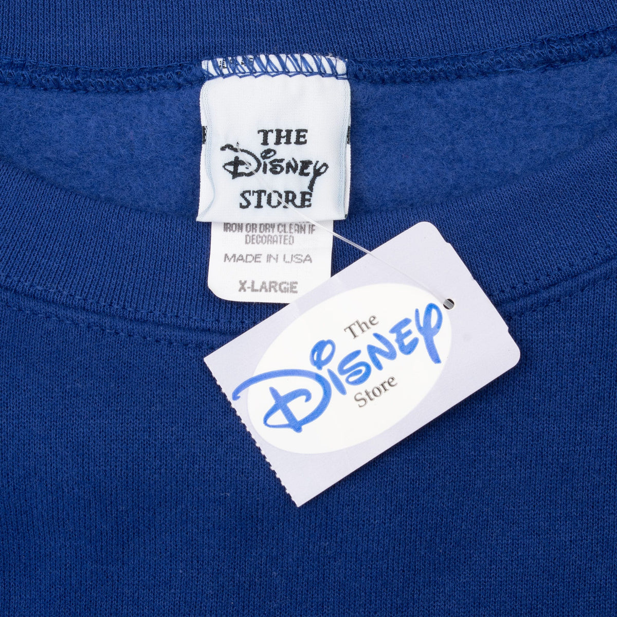 Disney Store X-Large neck label and hang tag on blue sweatshirt