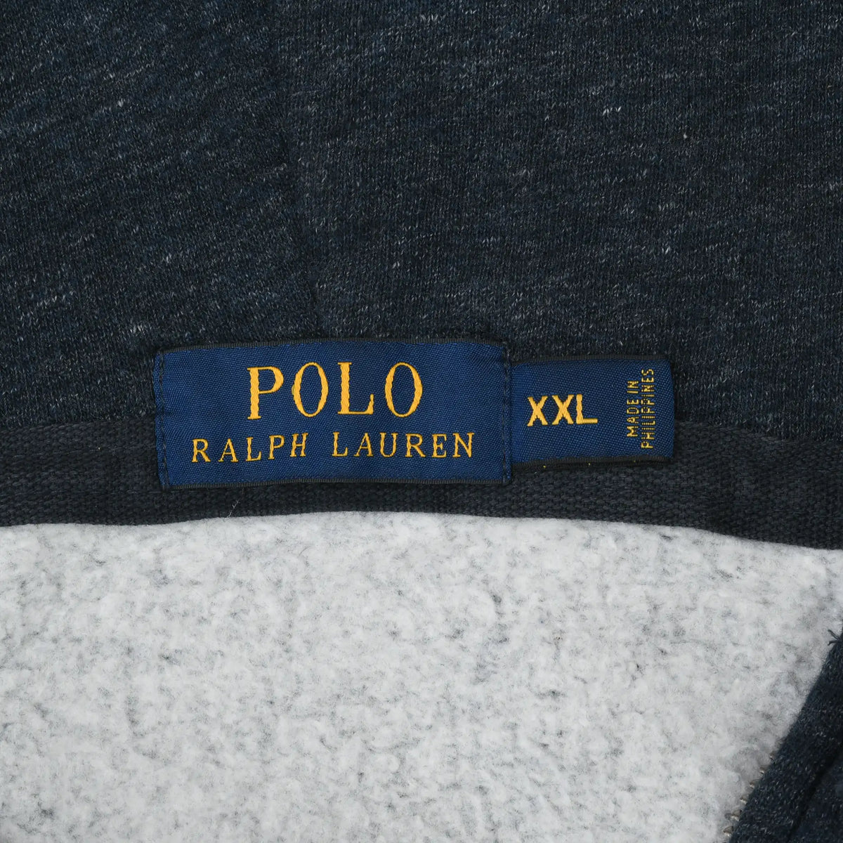 Polo Ralph Lauren neck label and XXL size tag inside blue hoodie