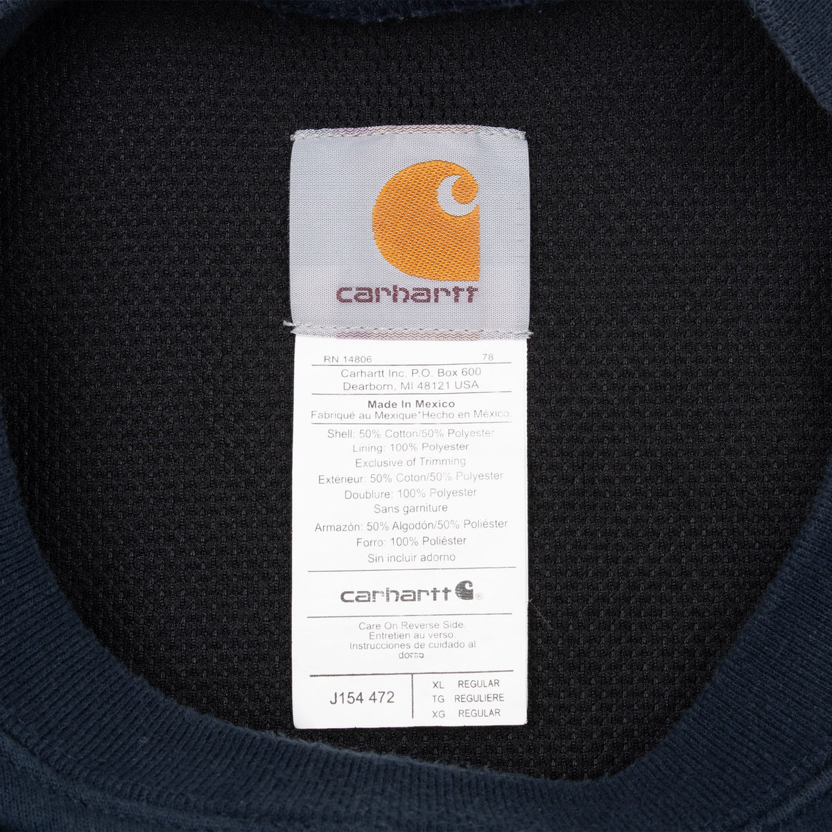 Carhartt neck label and care tag showing style code J154 472 and size XL