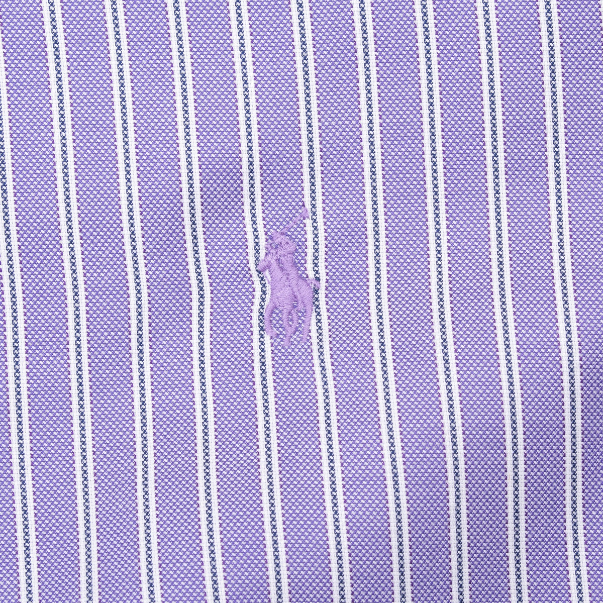 Close-up of embroidered Polo pony on lavender fabric with white and navy stripes