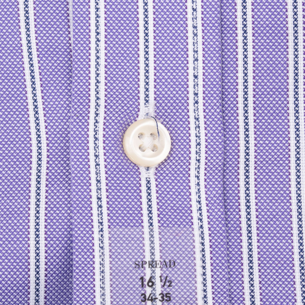 Close-up of shirt button, striped fabric, and printed 16 1/2 by 34/35 sizing