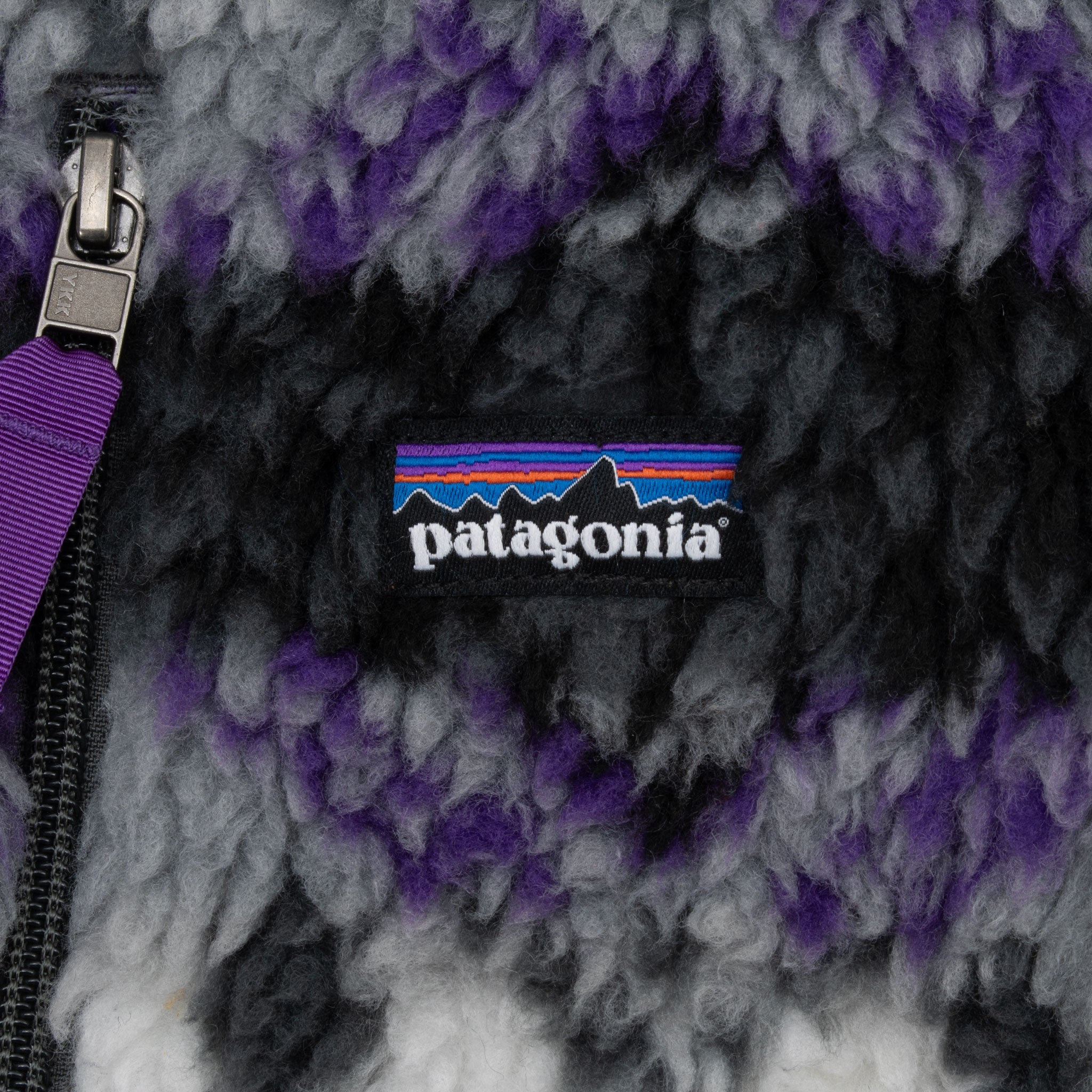 Patagonia logo patch on black, gray and purple deep-pile fleece