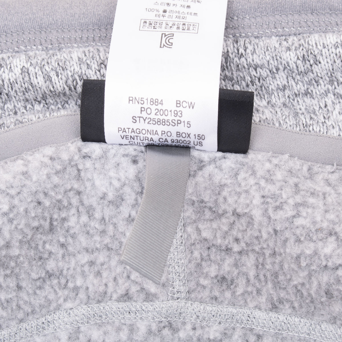 Interior care tag showing Patagonia style 25885 SP15 on grey fleece vest