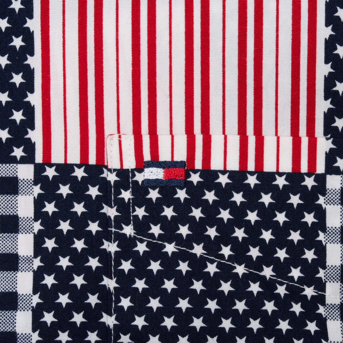 Chest pocket detail with embroidered Tommy Hilfiger flag logo, stars and red-and-white stripes