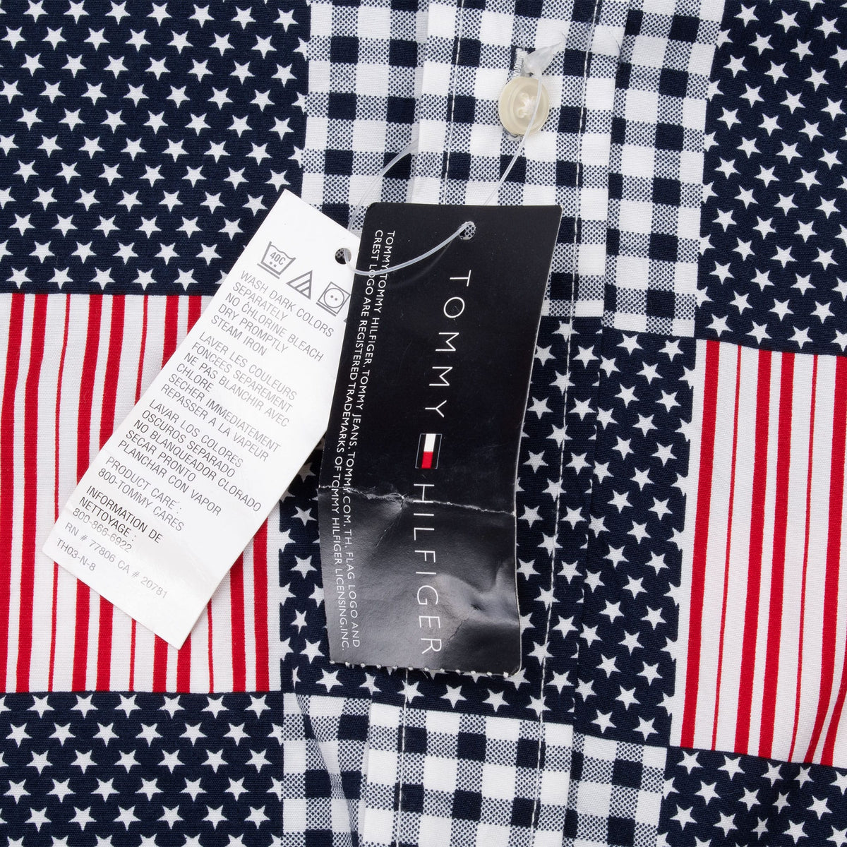 Attached Tommy Hilfiger hangtag and care tag against the stars, stripes and gingham patchwork
