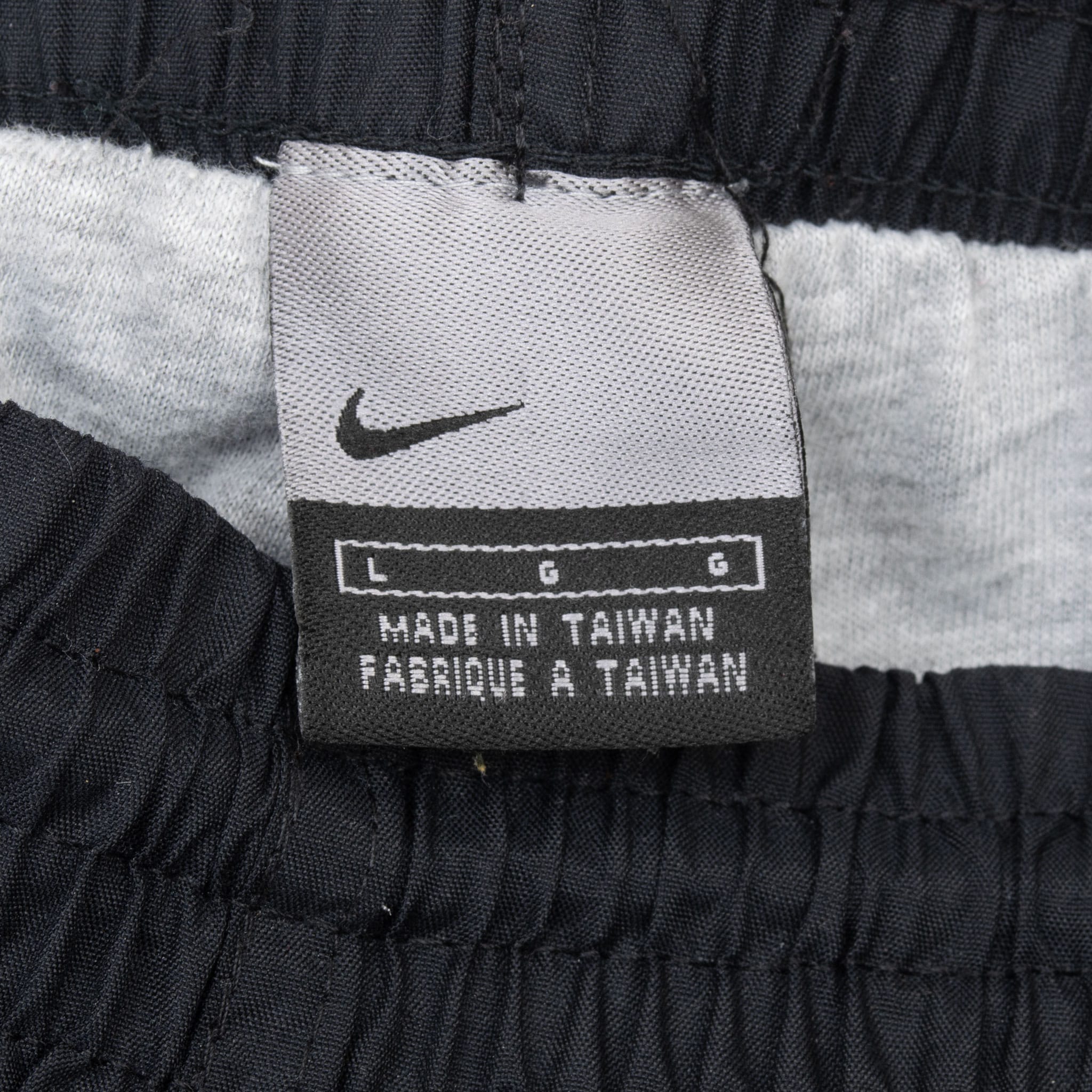 Nike waistband label showing size Large and Made in Taiwan