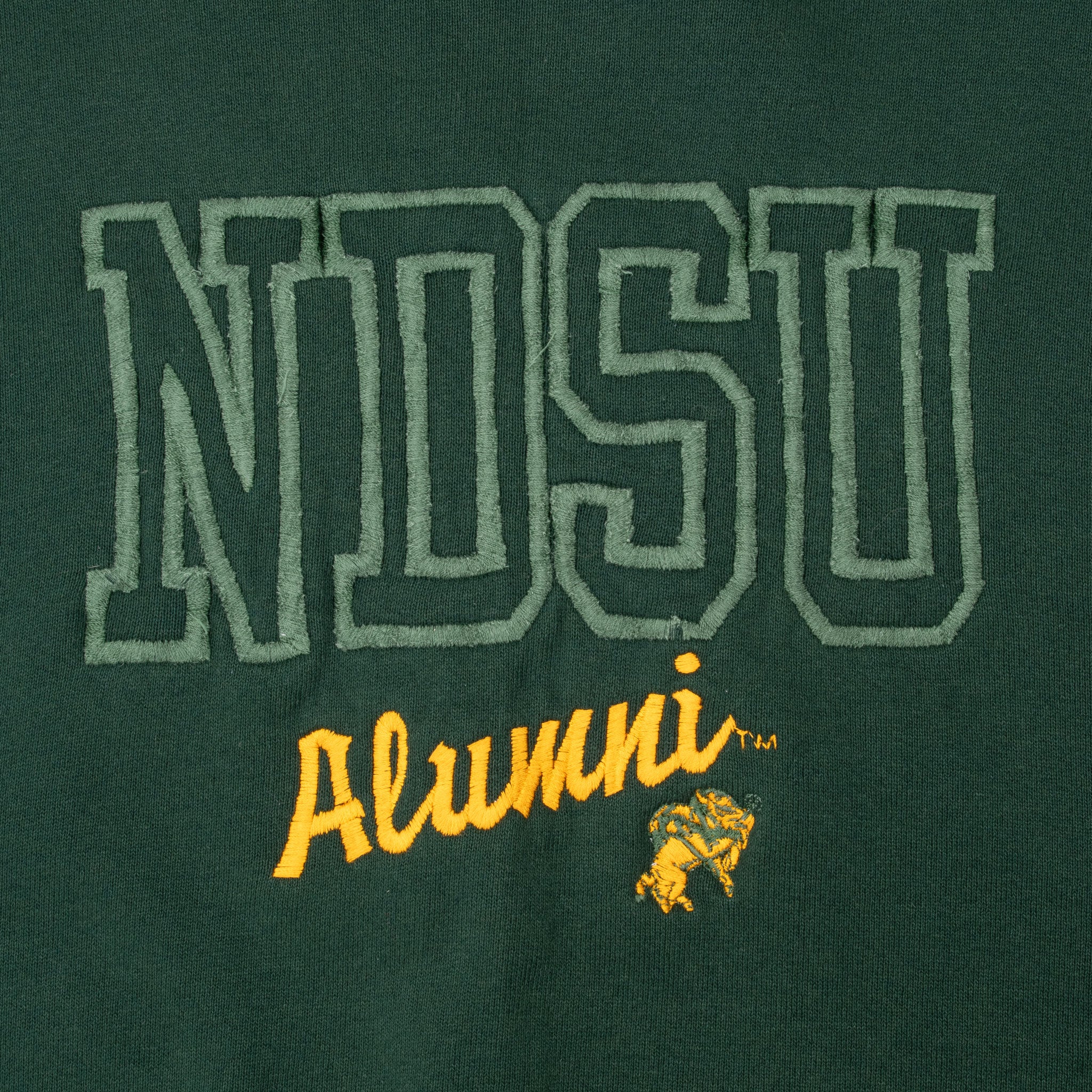 Close-up of green and yellow SDSU Alumni embroidery with Jackrabbit mascot