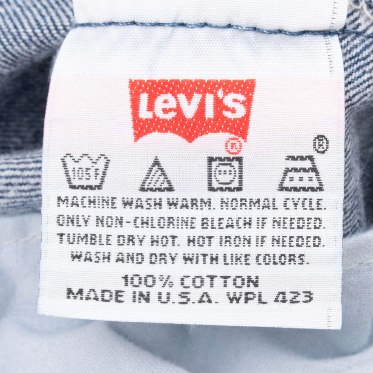 Levi's care label showing washing instructions, 100% cotton, and Made in USA
