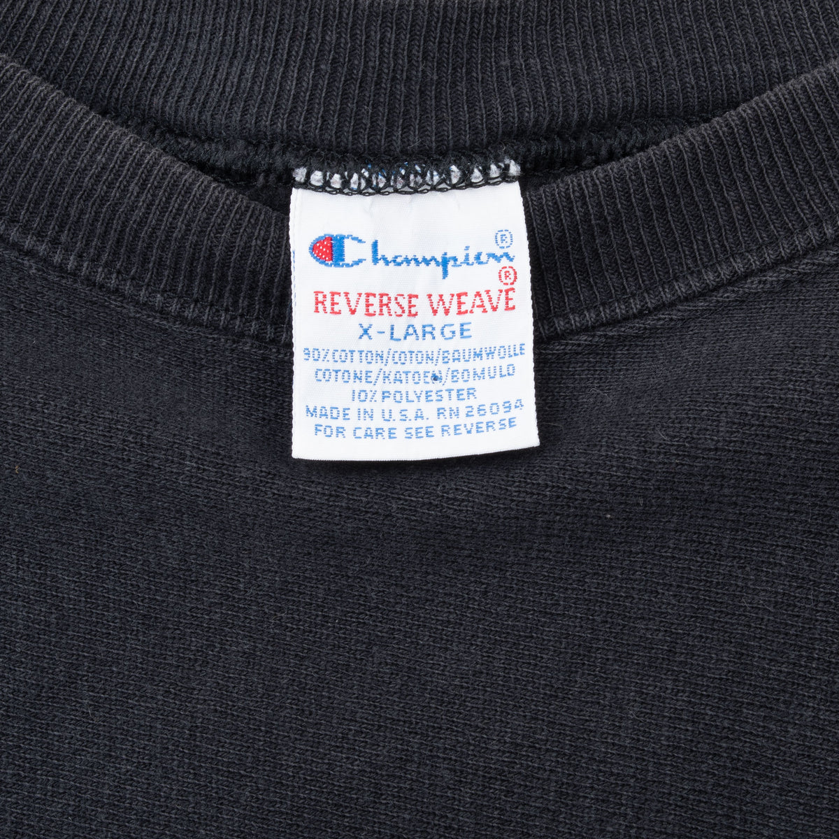 Champion Reverse Weave X-Large neck tag inside black sweatshirt