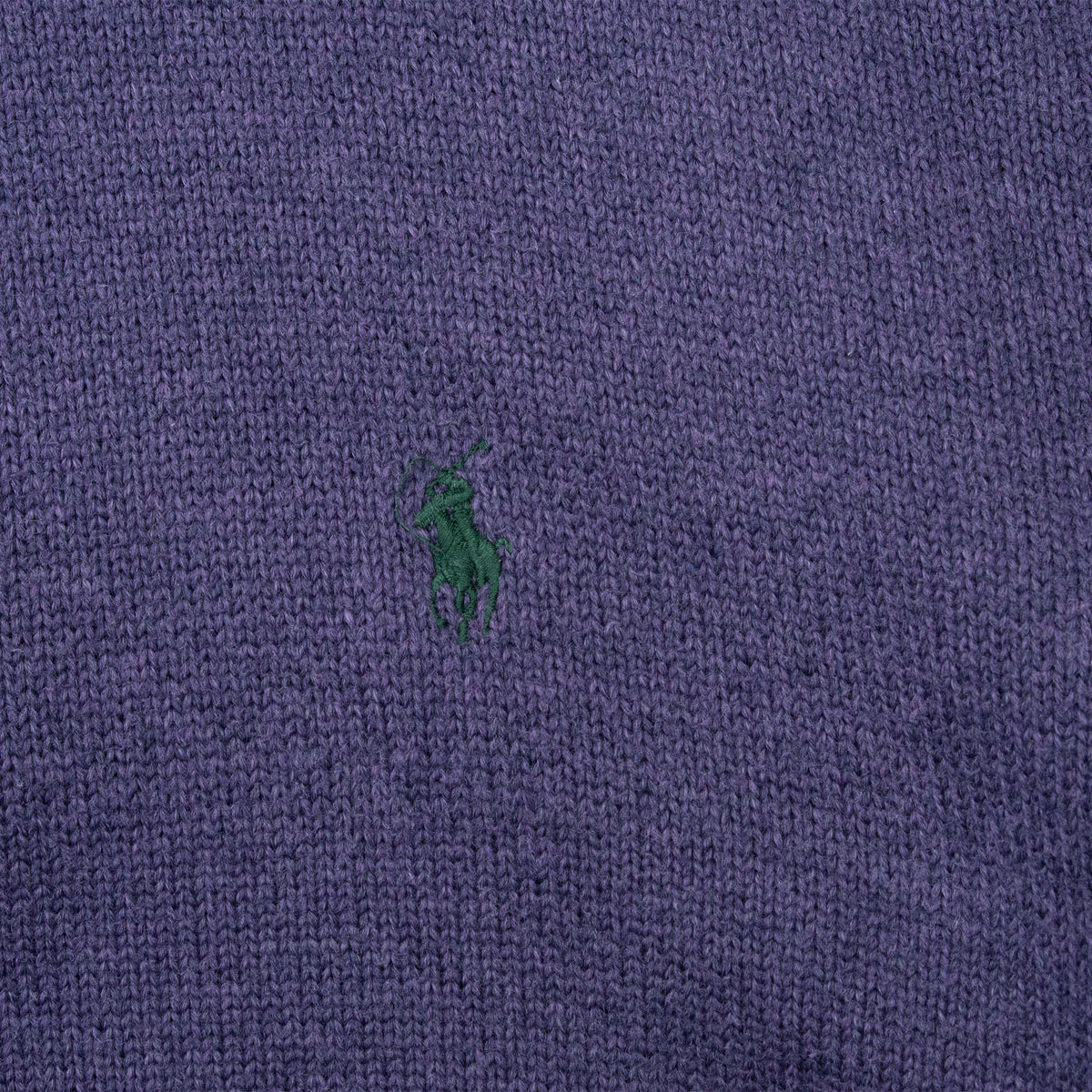 Green Polo pony embroidery detail on purple knit sweater
