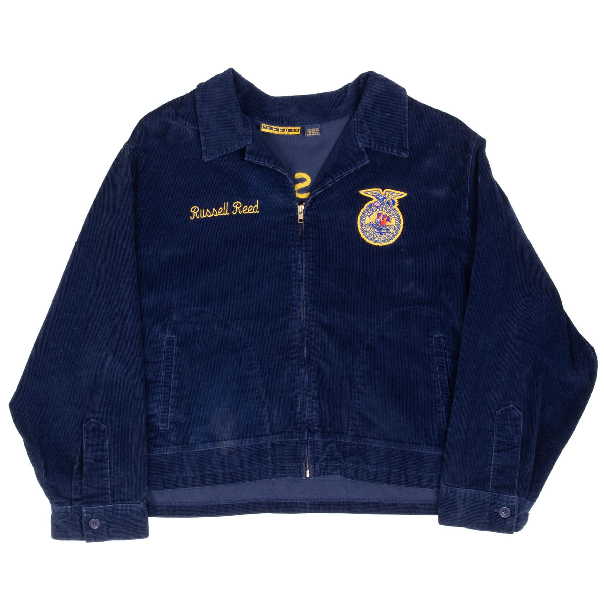 Front of navy FFA corduroy zip jacket with pointed collar, welt pockets and buttoned cuffs