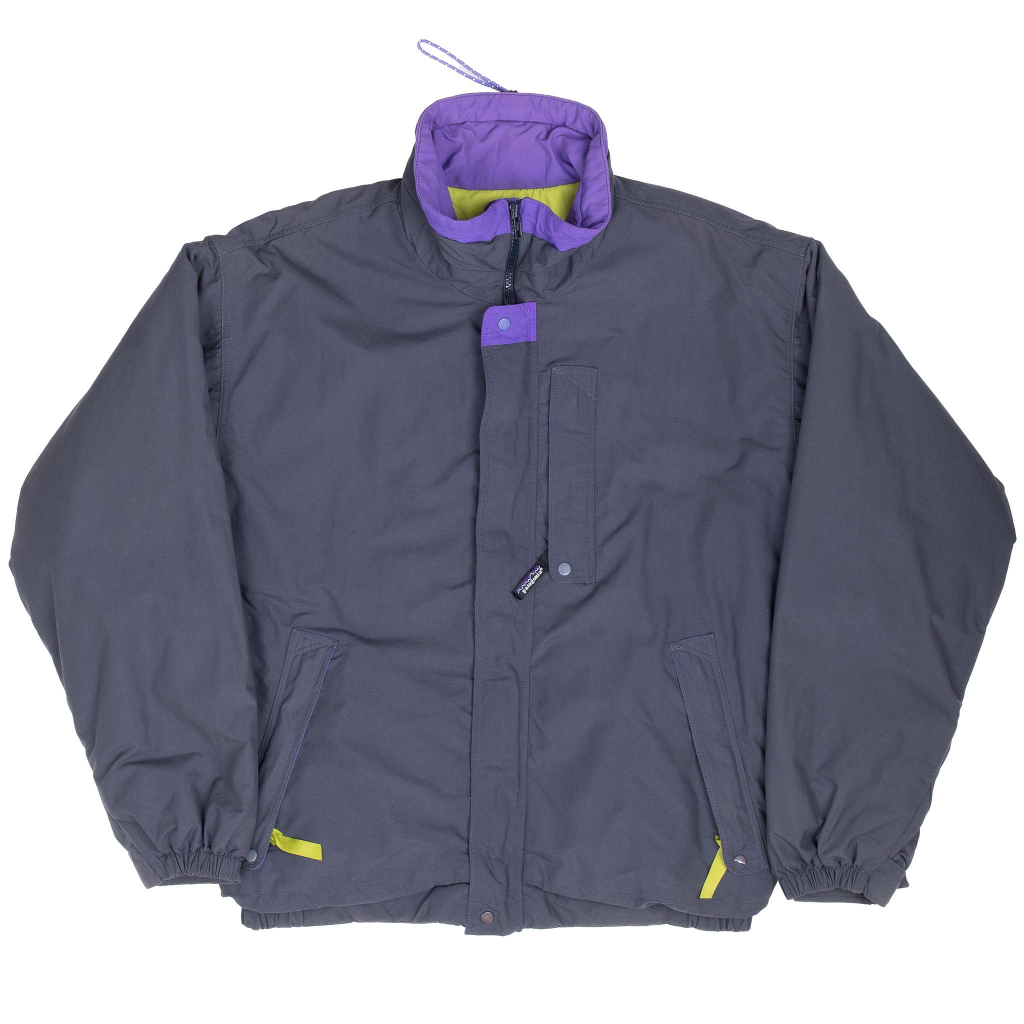 Full front view of dark grey Patagonia Alpine jacket with storm flap and angled hand pockets