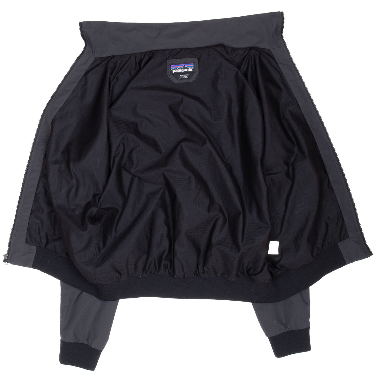 Open front view of Patagonia Baggies jacket showing the black interior lining