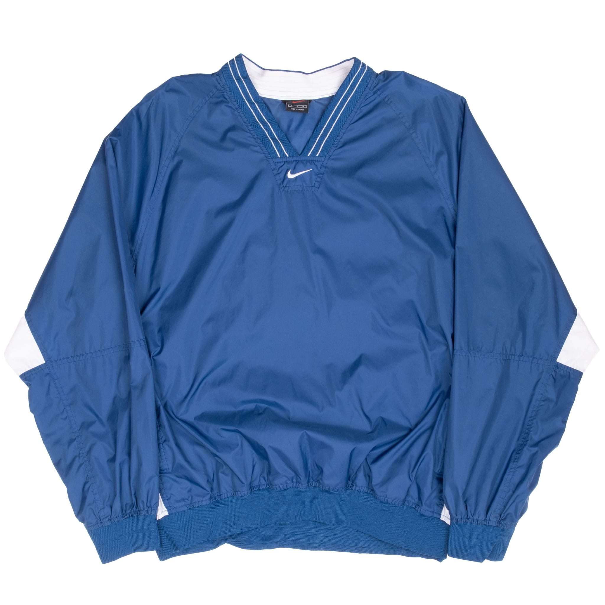 Full front of blue Nike pullover windbreaker with white elbow panels, ribbed cuffs and hem