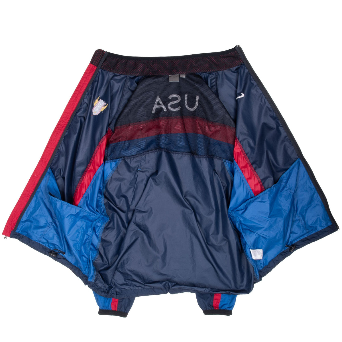 Interior view of open Nike Team USA windbreaker showing mesh lining and color-blocked panels