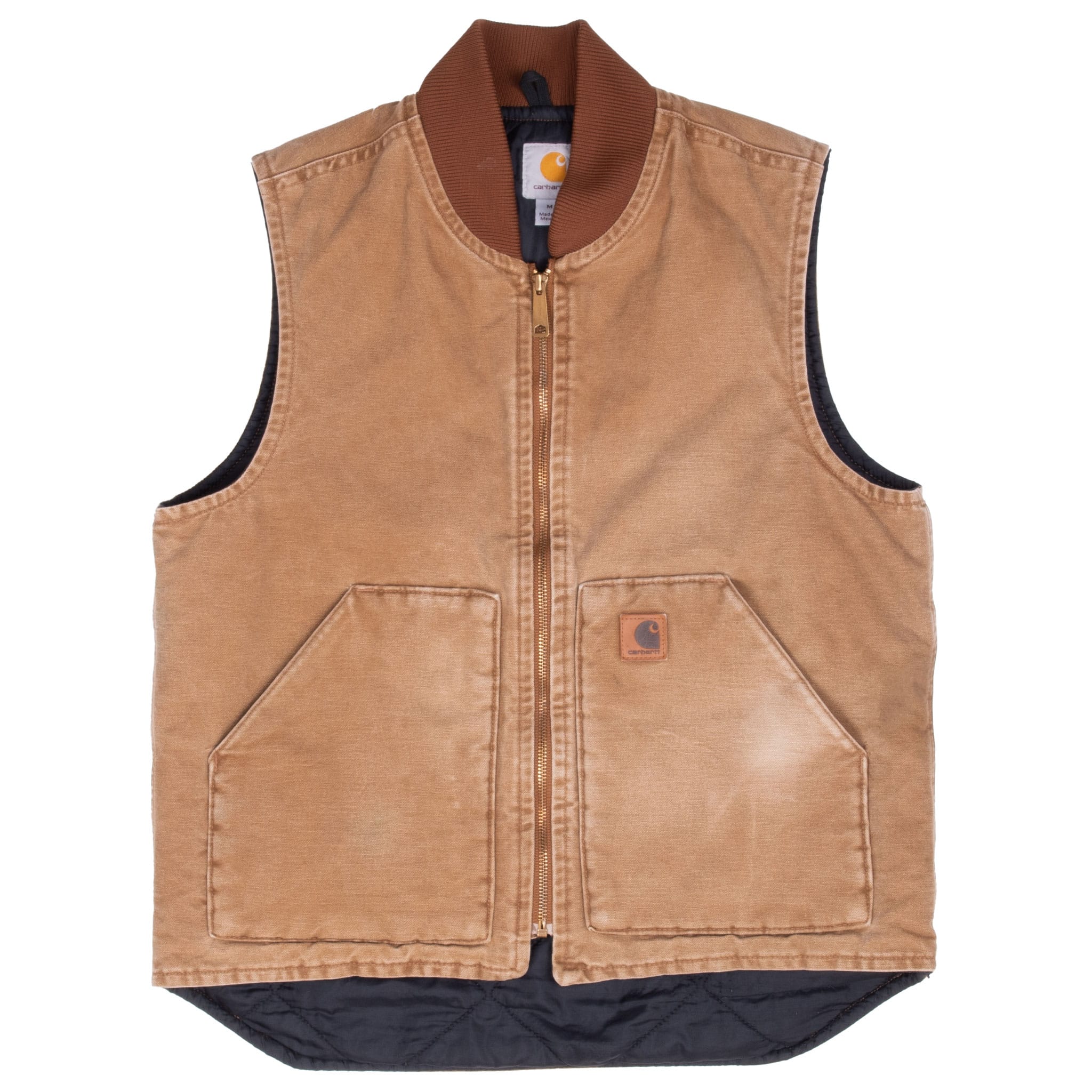 Front of brown Carhartt vest with dark quilted lining extending below the hem