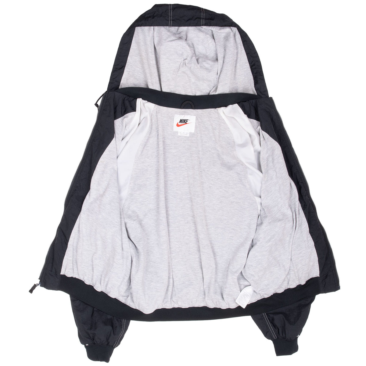 Open Nike windbreaker showing light gray interior lining and hood
