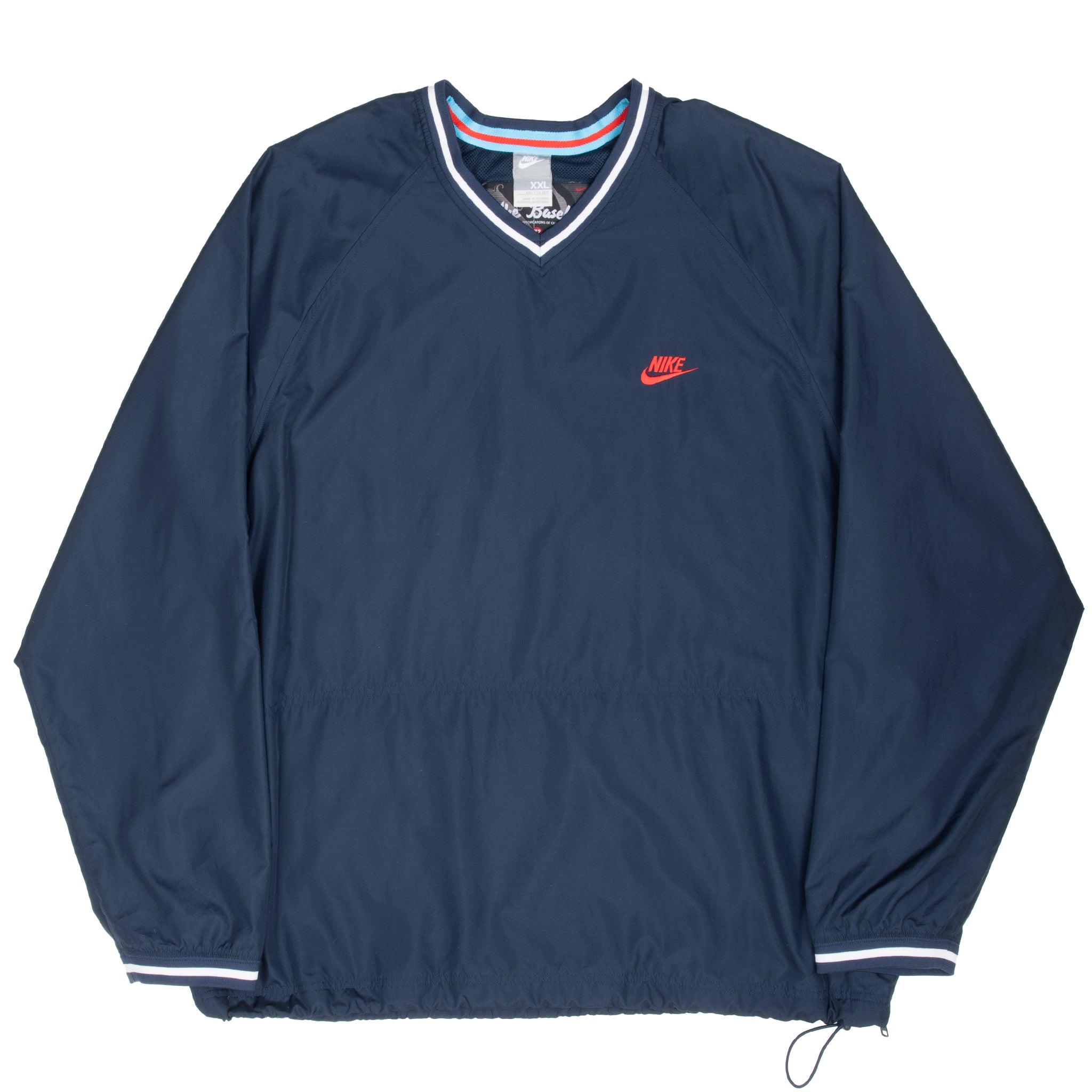 Full front of navy Nike baseball windbreaker pullover with drawcord hem