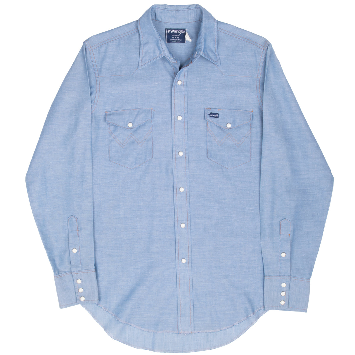 Full front of blue Wrangler chambray Western shirt with pearl snap pockets