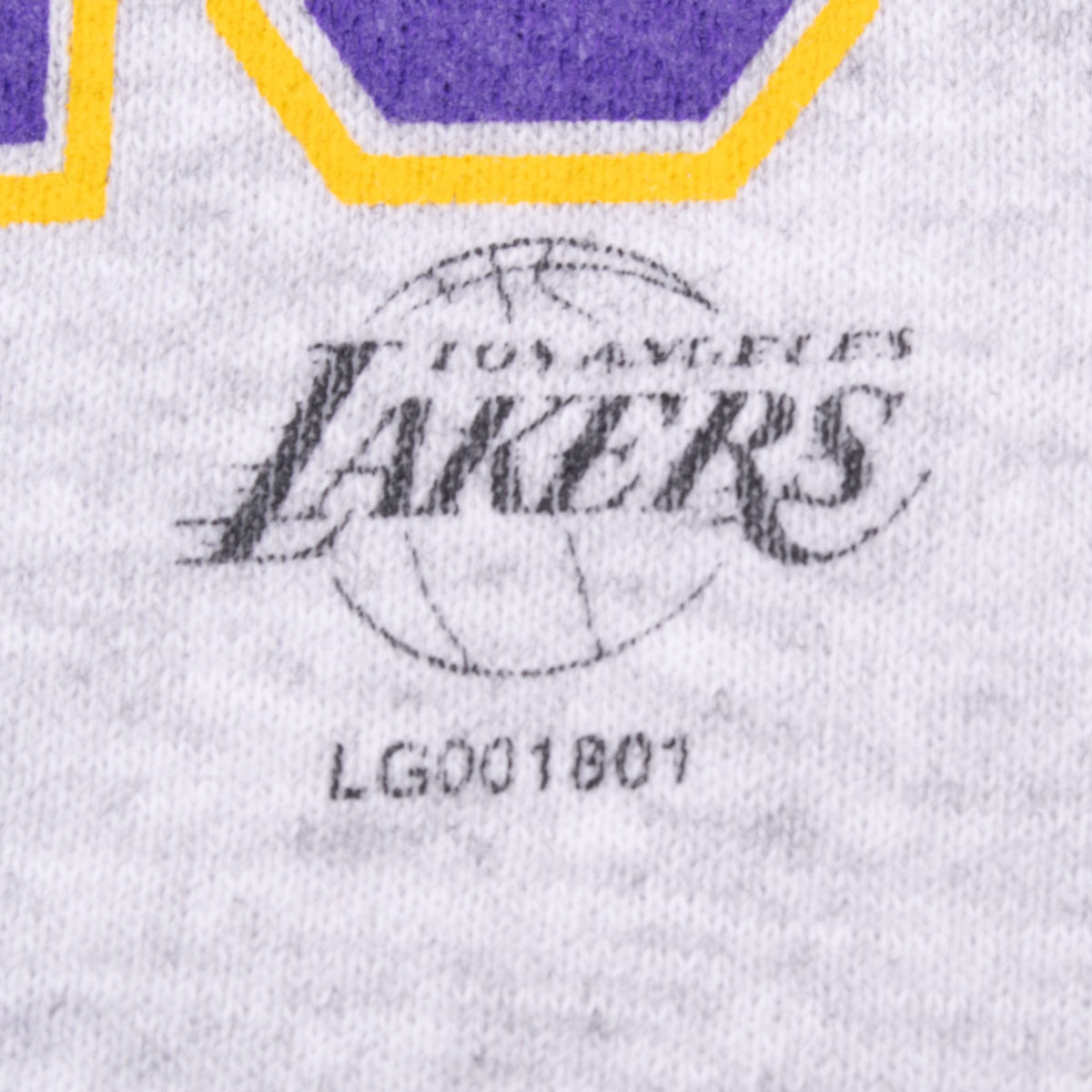 Close-up of Los Angeles Lakers logo and LG001901 code printed beneath front graphic