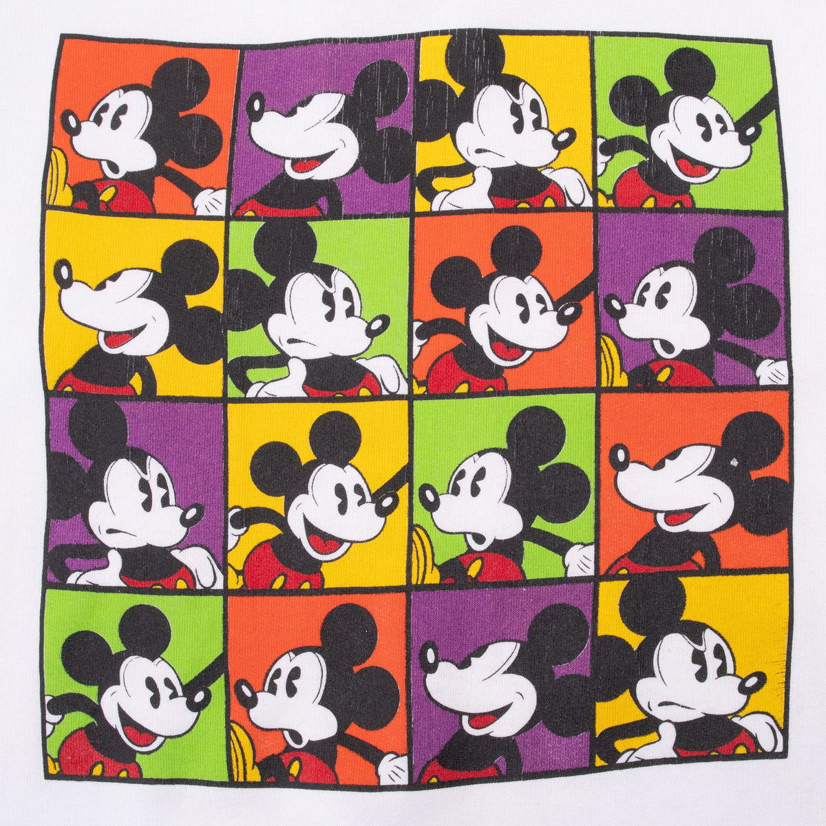 Close-up of 16-panel Mickey Mouse print in orange, purple, yellow, and green