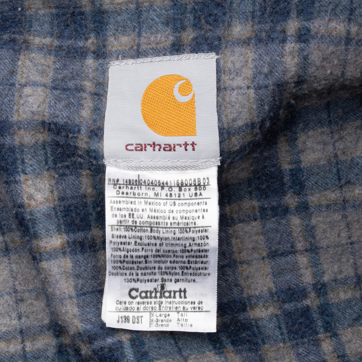 Carhartt J139 DST label on plaid jacket lining
