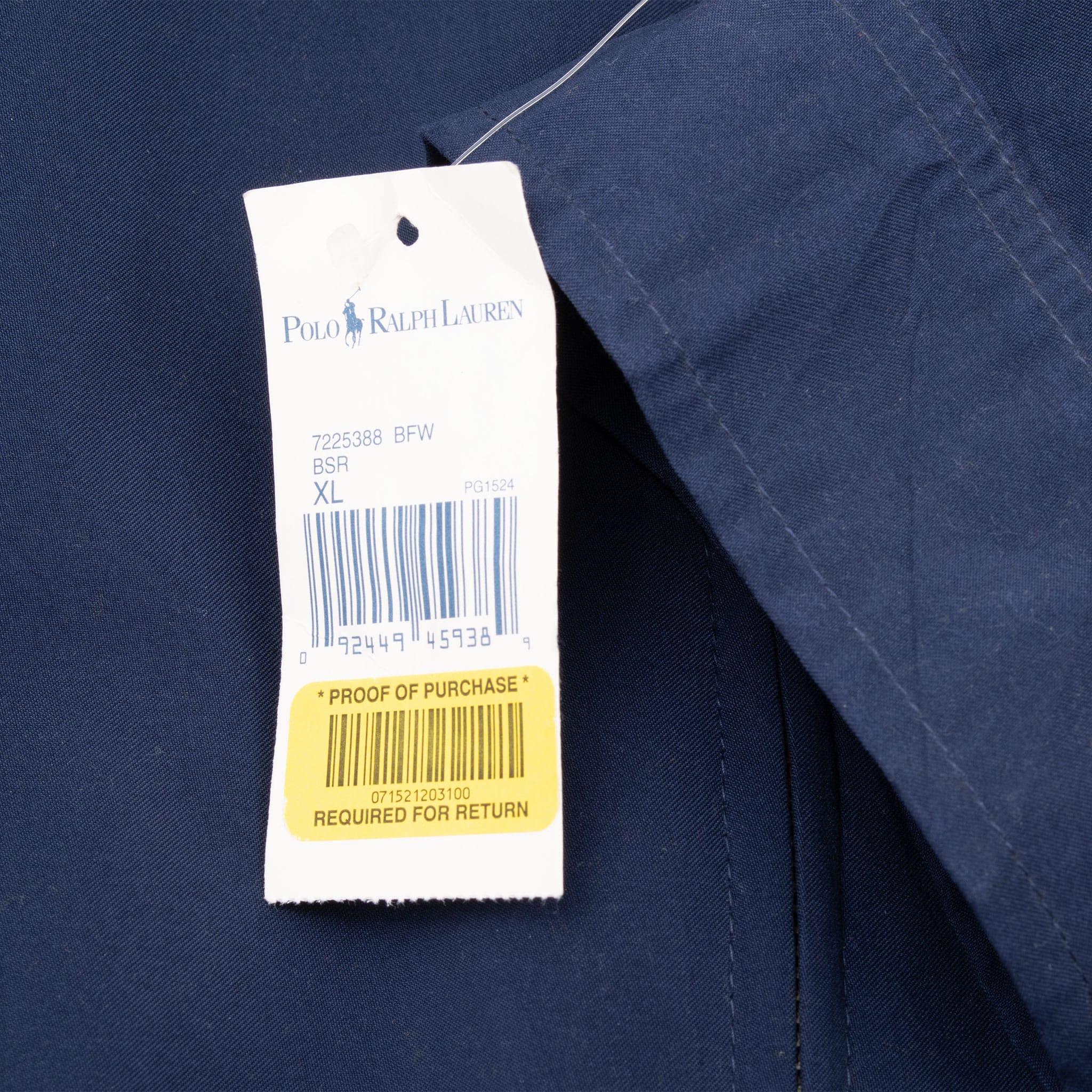 Polo Ralph Lauren barcode hangtag marked XL attached to blue jacket
