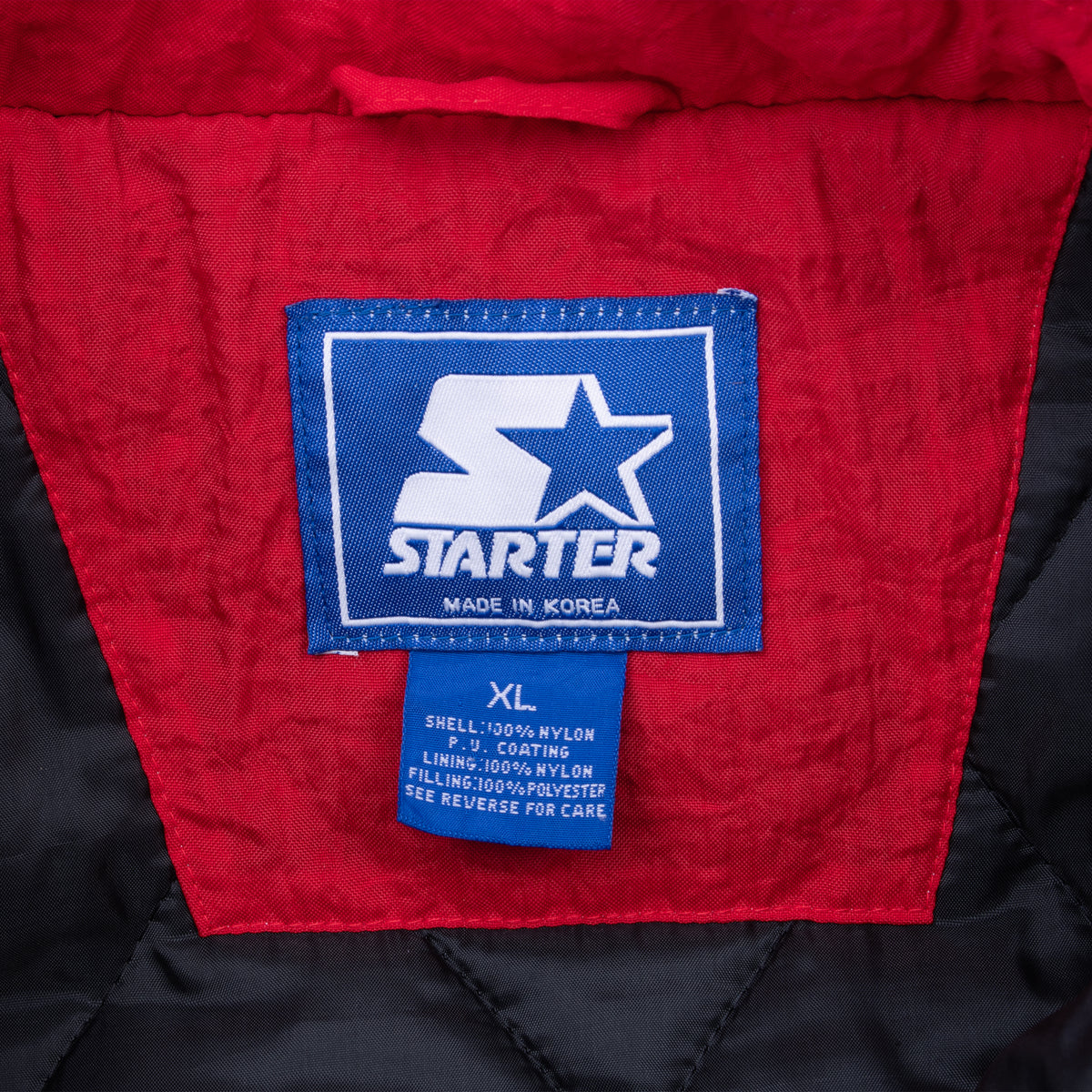 Starter neck label and XL size tag inside University of Utah jacket