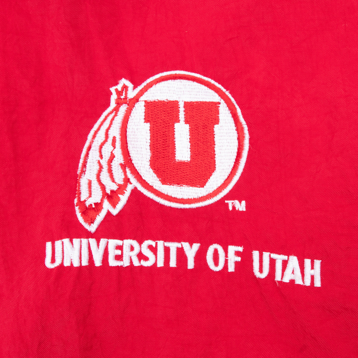University of Utah U logo and lettering embroidered on red jacket chest